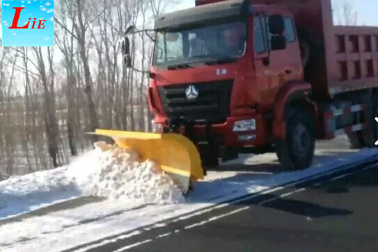 Truck snow blade snow removal